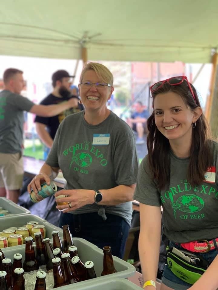 World Expo of Beer volunteers smiling while serving samples
